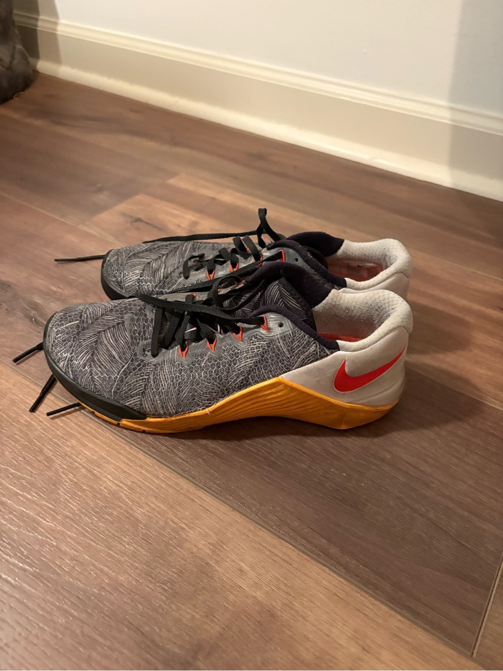 Nike Women’s Gray Athletic Shoes with Orange-Gold Midsole and Red Swoosh